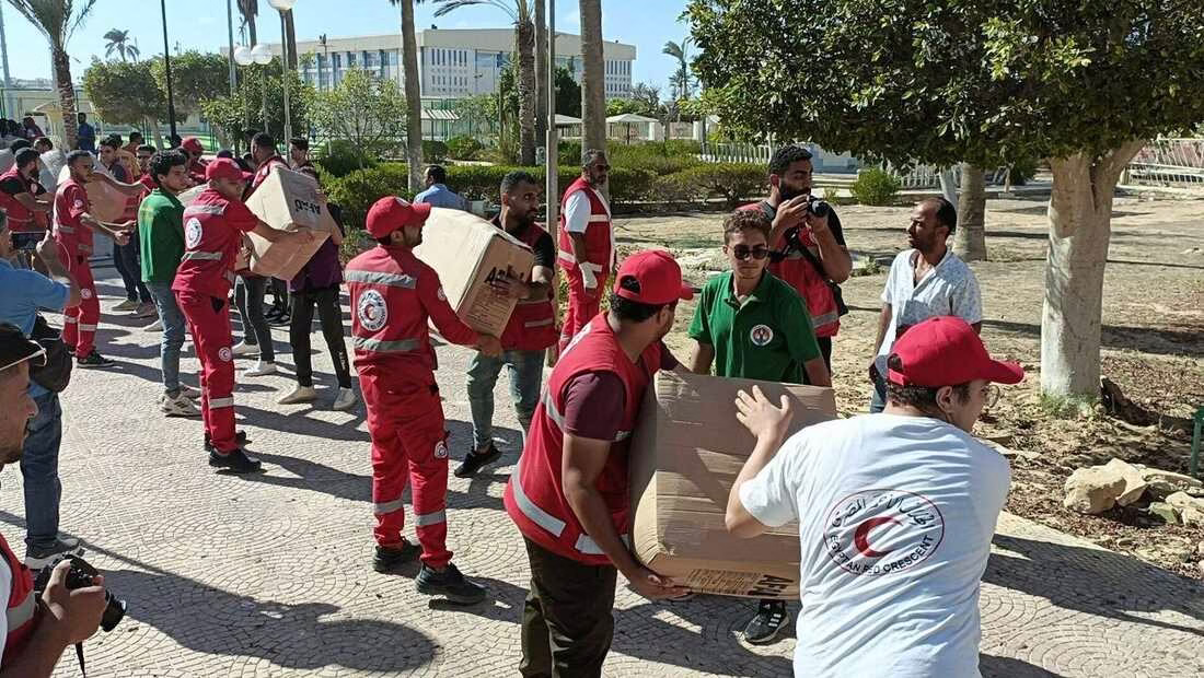 ARISH, EGYPT - OCTOBER 13: Workers load the trucks with boxes after a planes carrying Turkish humanitarian aid for residents of the Gaza Strip landed at El Arish International Airport in Egypt, neighboring the enclave under intense Israeli blockade and bombardment on October 13, 2023. (Photo by Stringer/Anadolu via Getty Images)