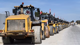 epa11904976 Reconstruction equipment bound for Gaza waits to cross the Rafah border point between Egypt and the Gaza Strip, in Rafah, Egypt, 18 February 2025. EPA/Mohamed Hossam